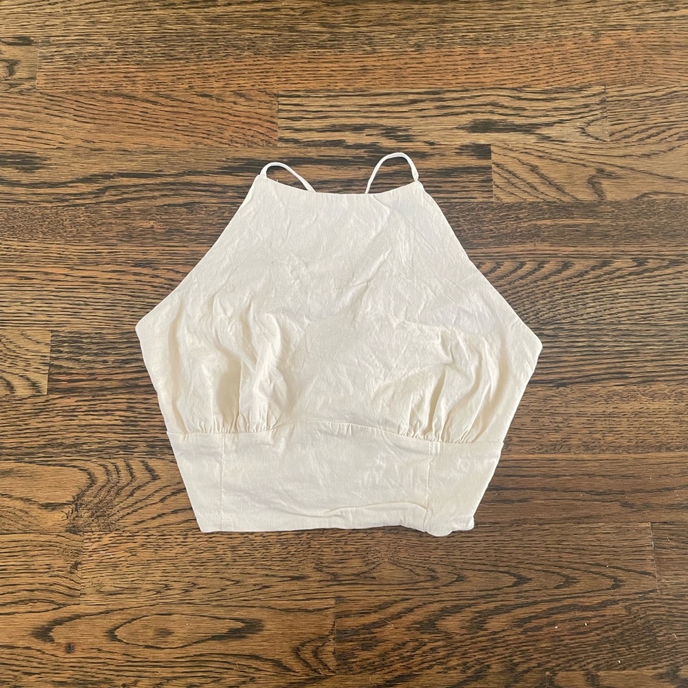 Cream halter crop top with open cross back, size M